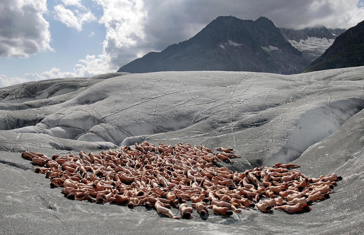Naked volunteers lie on Aletsch glacier